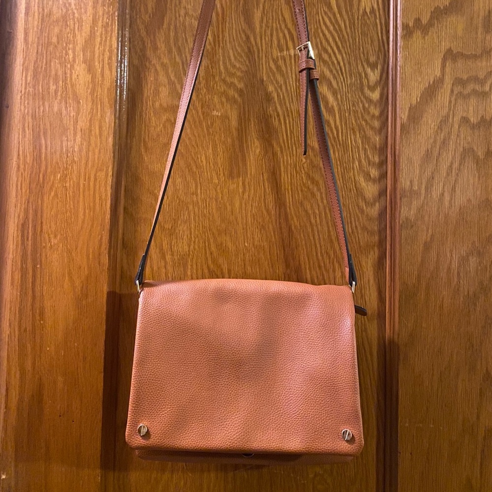 Demi fold over vegan leather crossbody bag.